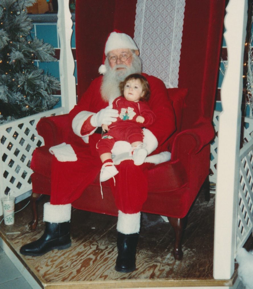 Young child sitting on Santa