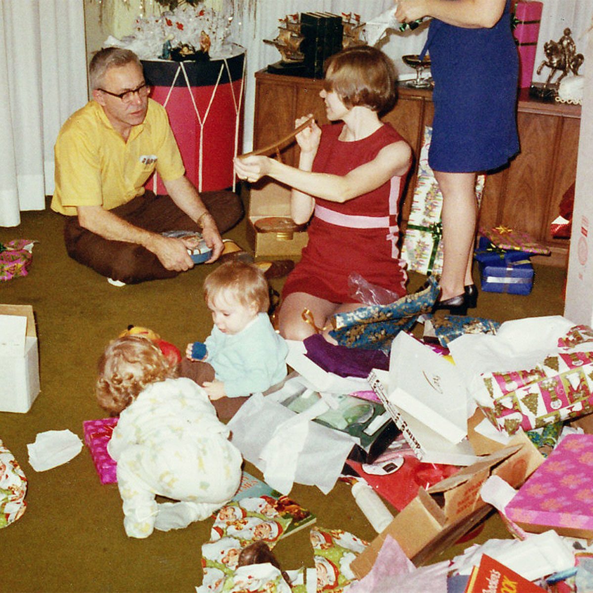 Family opening presents on Christmas Day