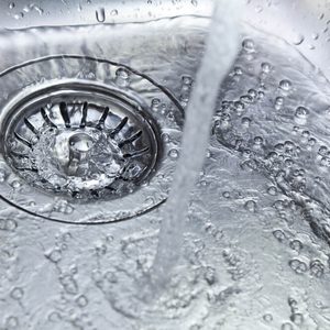 water flowing down the kitchen sink