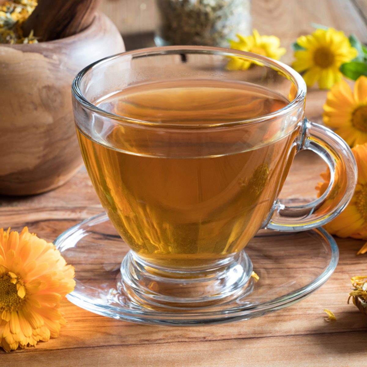 Calendula tea with calendula flowers on a wooden table; Shutterstock ID 727124293; Job (TFH, TOH, RD, BNB, CWM, CM): TOH
