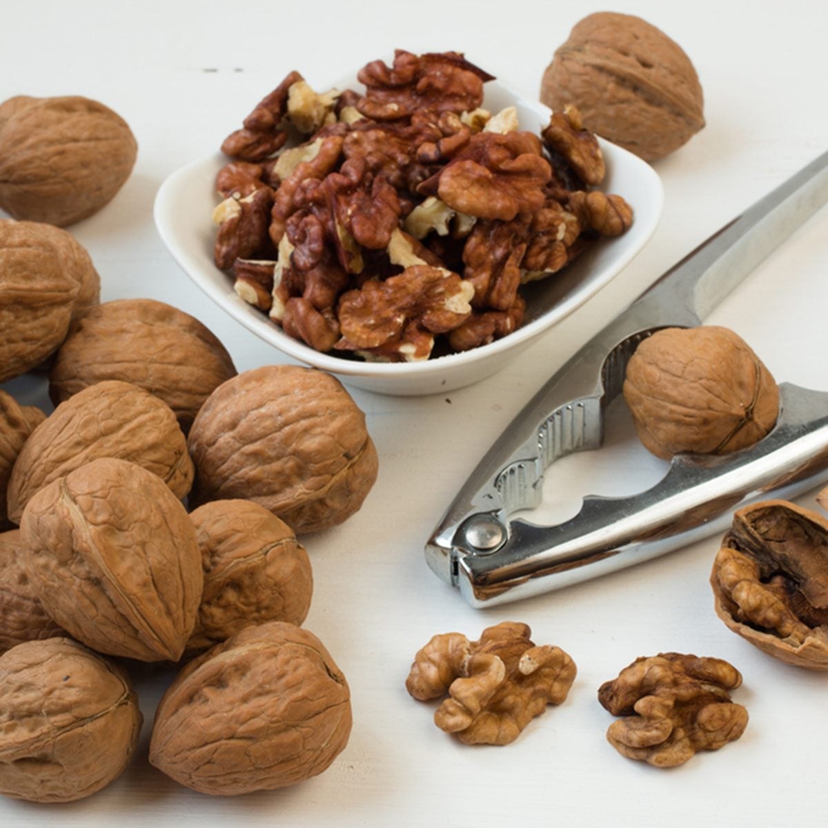 Walnuts.Whole walnuts,walnuts kernels and nutcracker.; Shutterstock ID 348316256