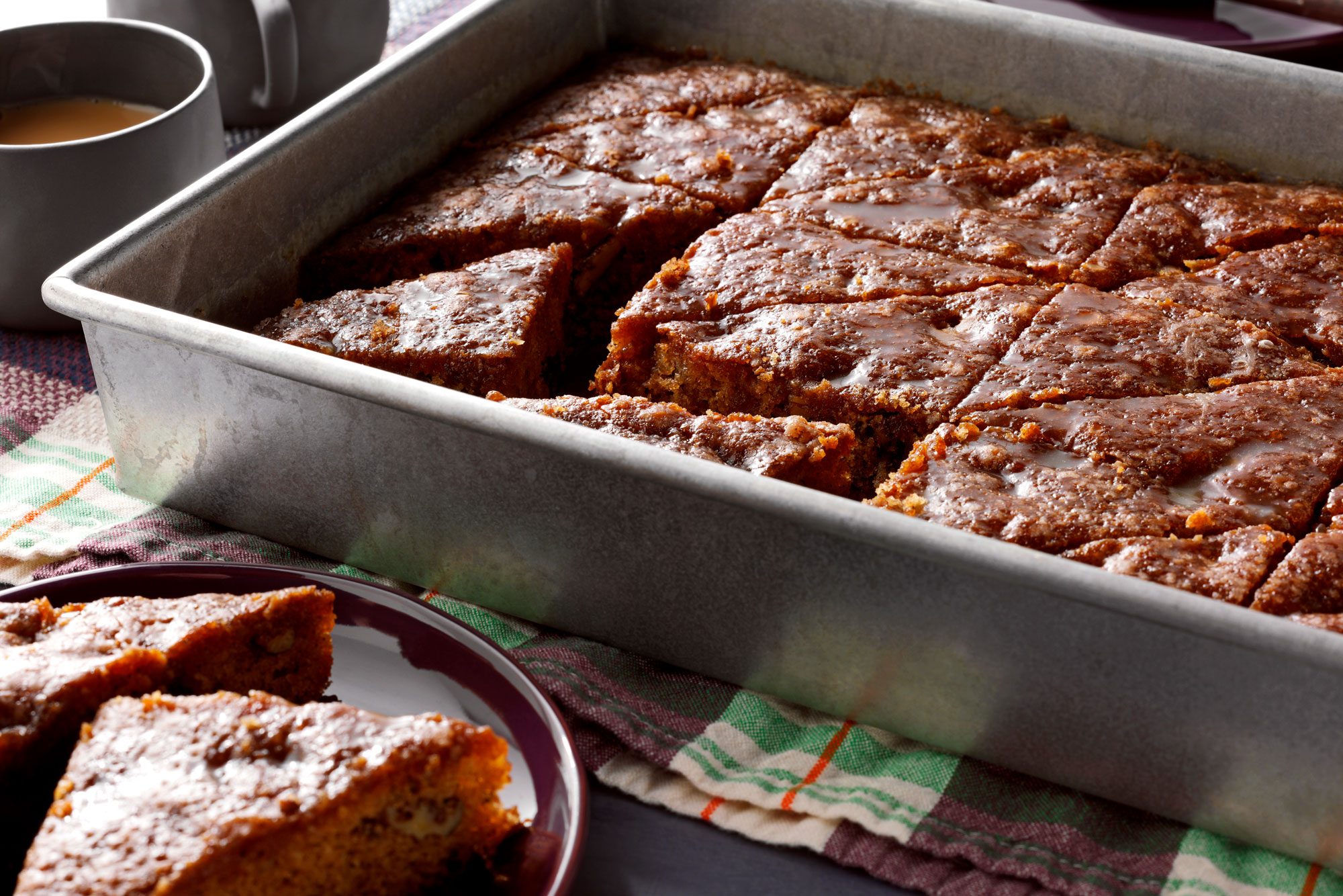 Prune Cake With Glaze sliced and served in plate