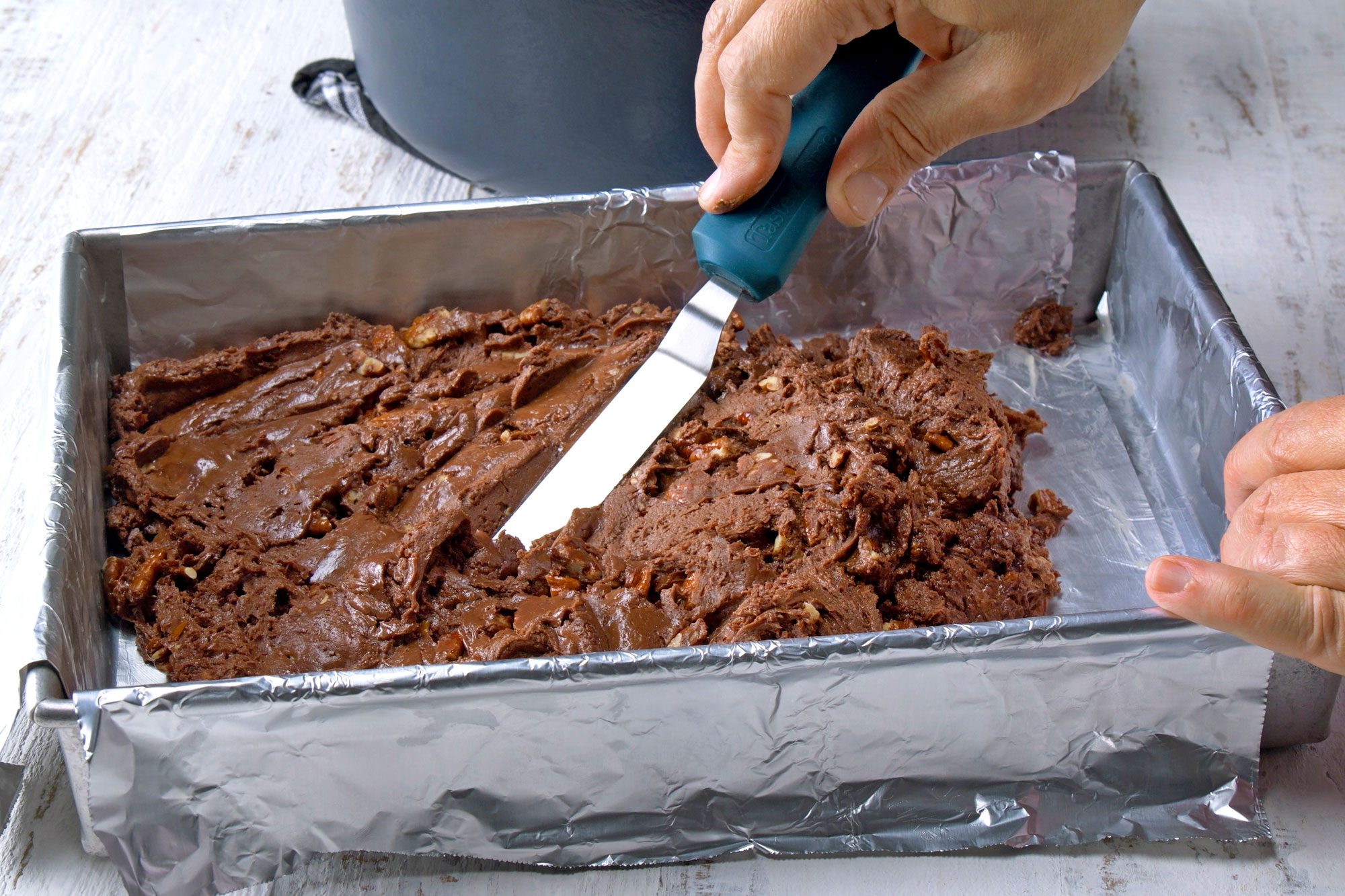 Settling the mix in foiled pan