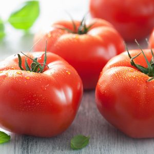 fresh beef tomatoes and basil leaves