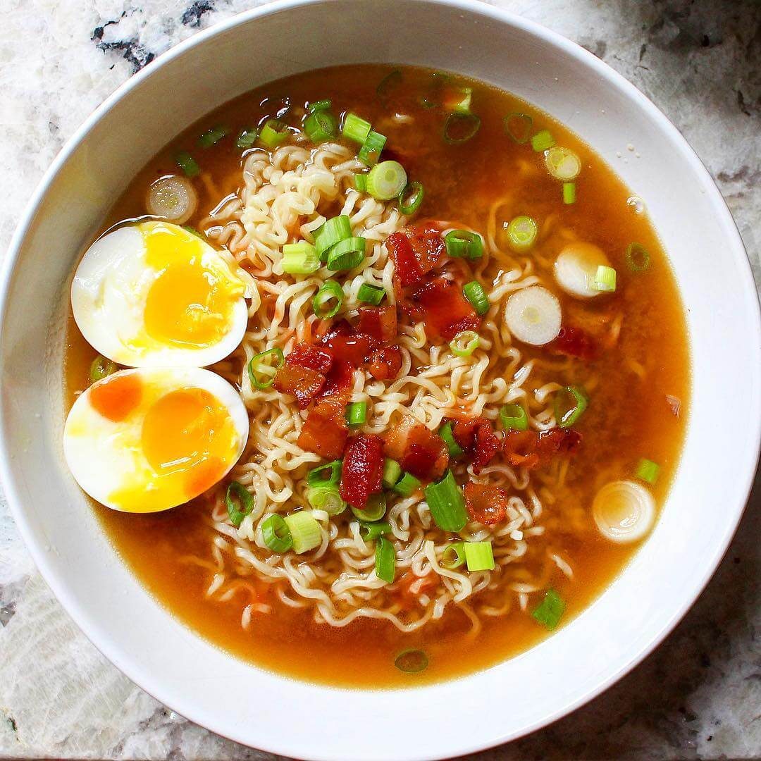 Ramen topped with an egg and bacon
