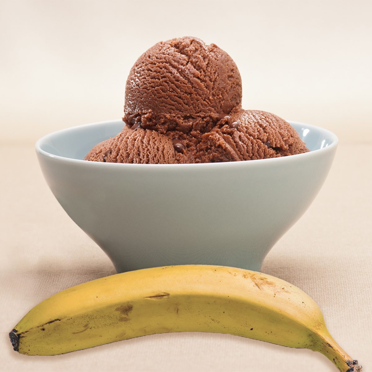 chocolate ice cream over a beige background