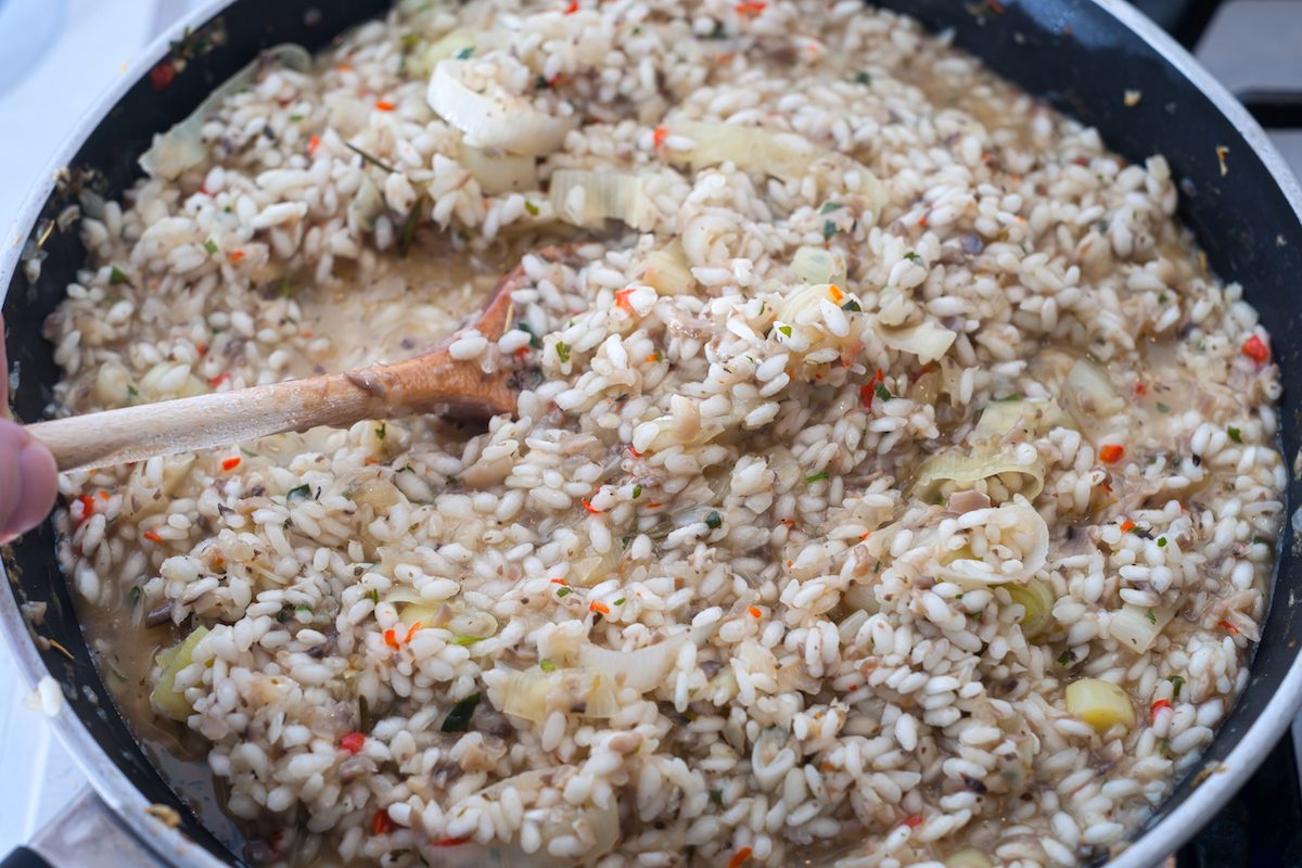 Preparing risotto on the stovetop using arborio rice.