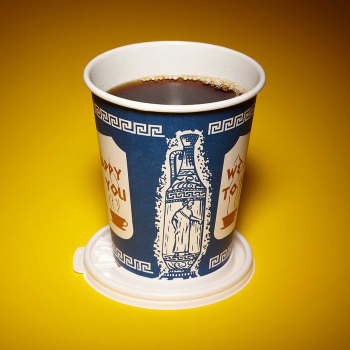 Cup using its lid as a coaster