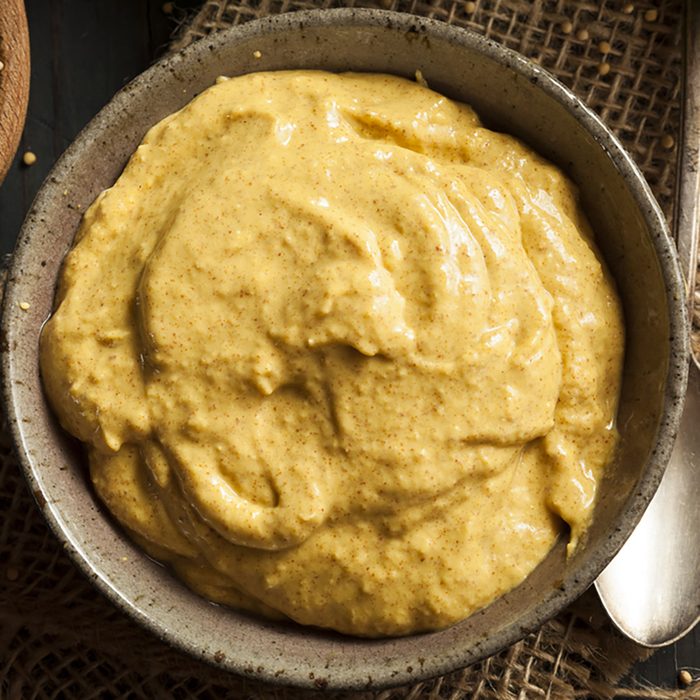 Homemade Spicy Mustard Sauce on a Background