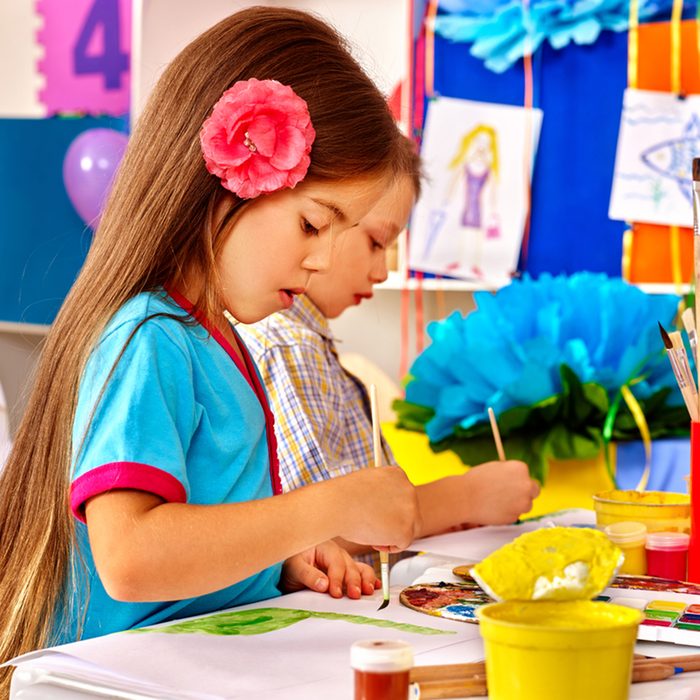 kids with brushes painting