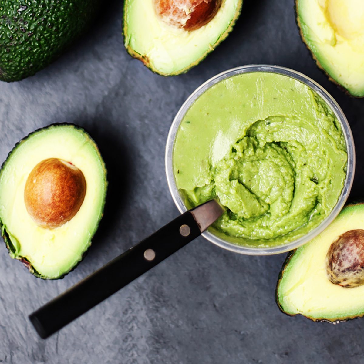 Guacamole. Avocado on a black background,