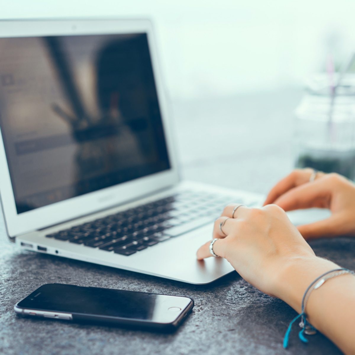 Pretty Young Beauty Woman Using Laptop in cafe
