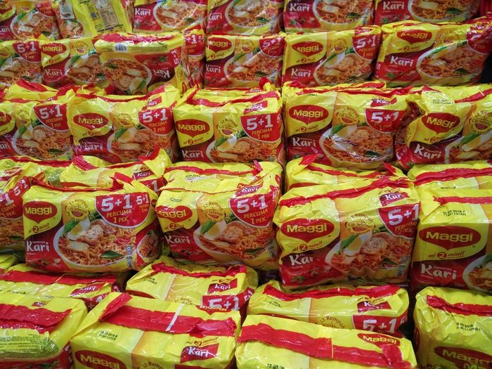 KUALA LUMPUR, MALAYSIA - 18 JUNE, 2017 : Maggi instant noodles. Owned by Nestle, Maggi is an international brand of soups, stocks, bouillon cubes, ketchup, sauces, seasonings and instant noodles.