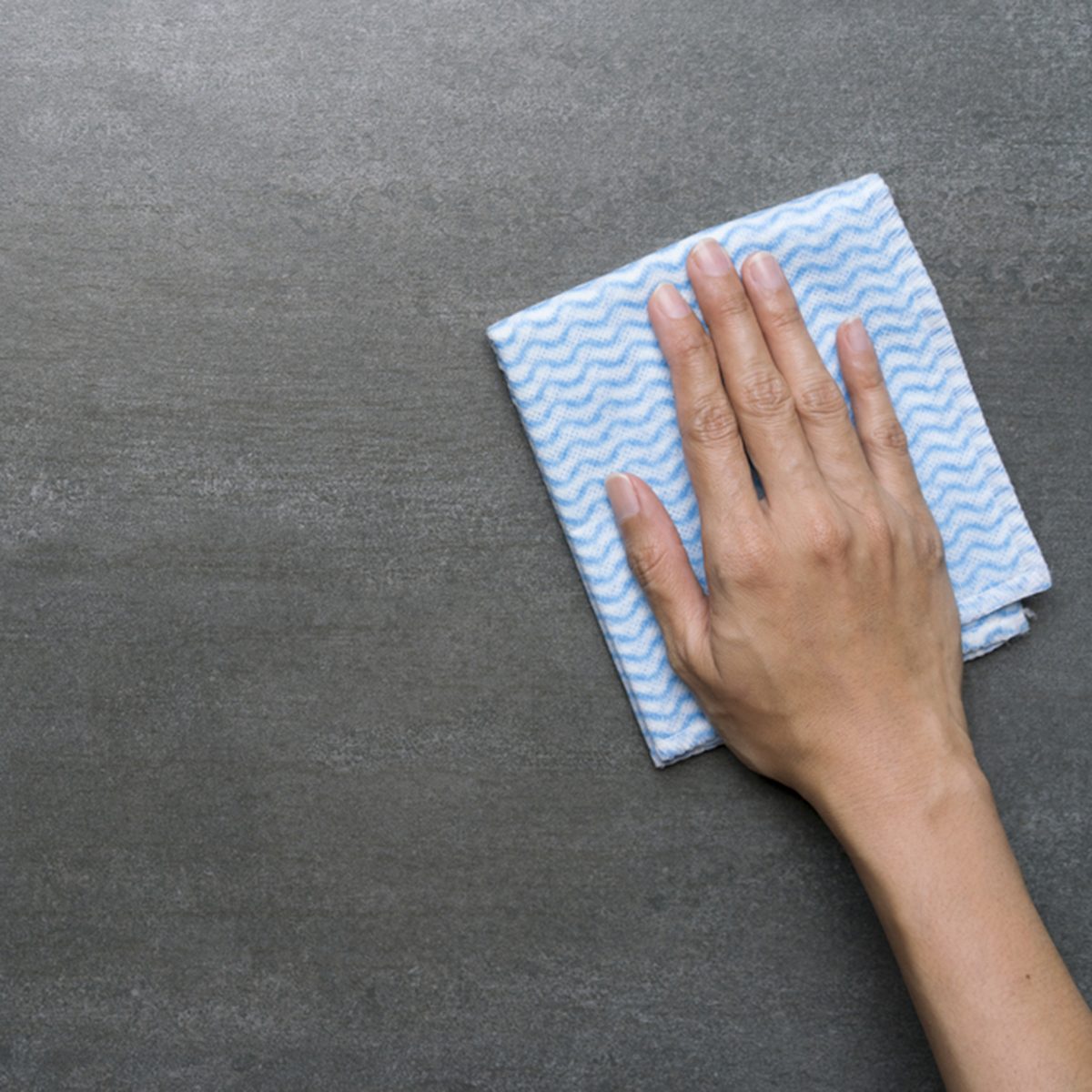 Cleaning black table by woman hand; Shutterstock ID 669645112; Job (TFH, TOH, RD, BNB, CWM, CM): TOH