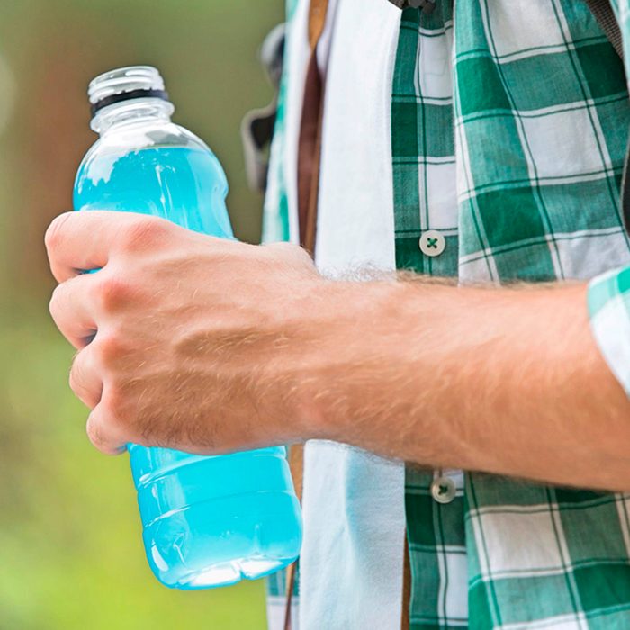 Person holding an energy drink