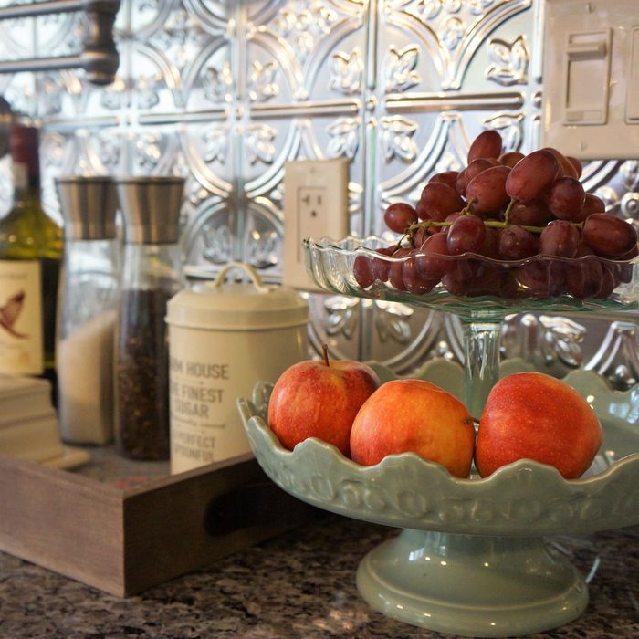 Kitchen with a pressed tin backsplash