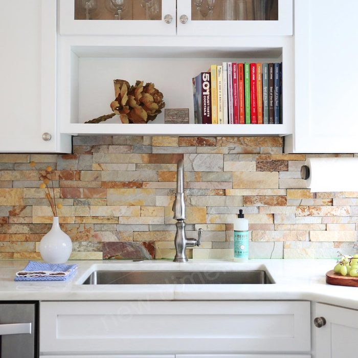 Kitchen with a stone backsplash