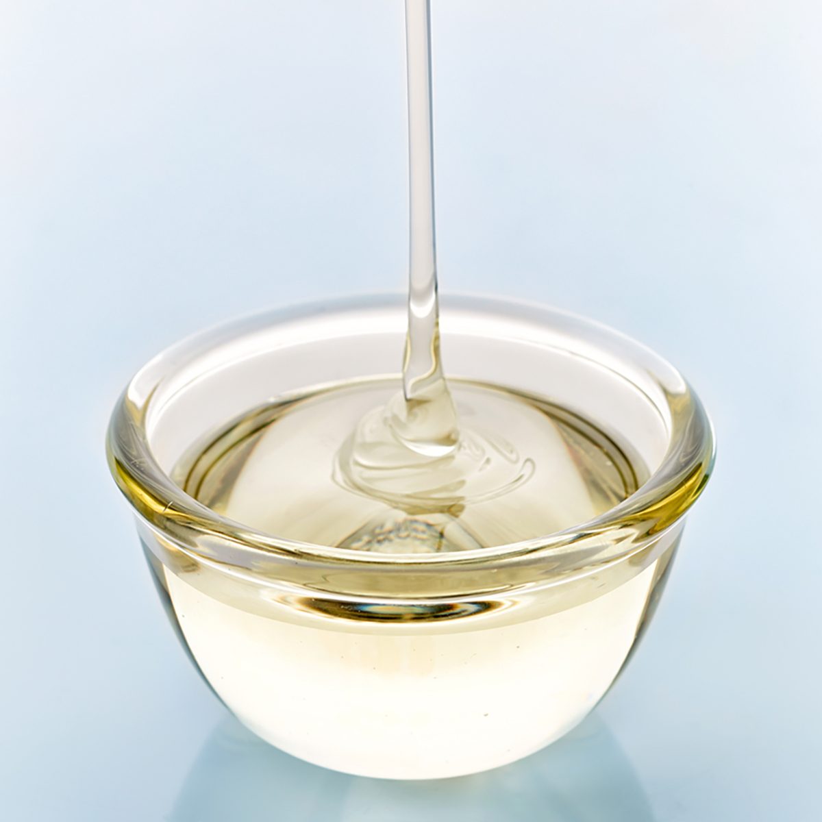 sugar syrup pouring into glass bowl