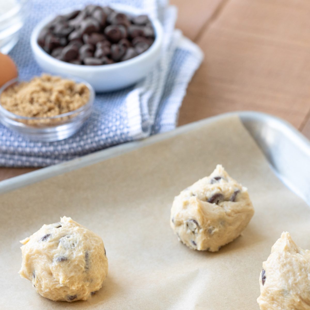 Chocolate chip cookie dough balls on a baking sheet