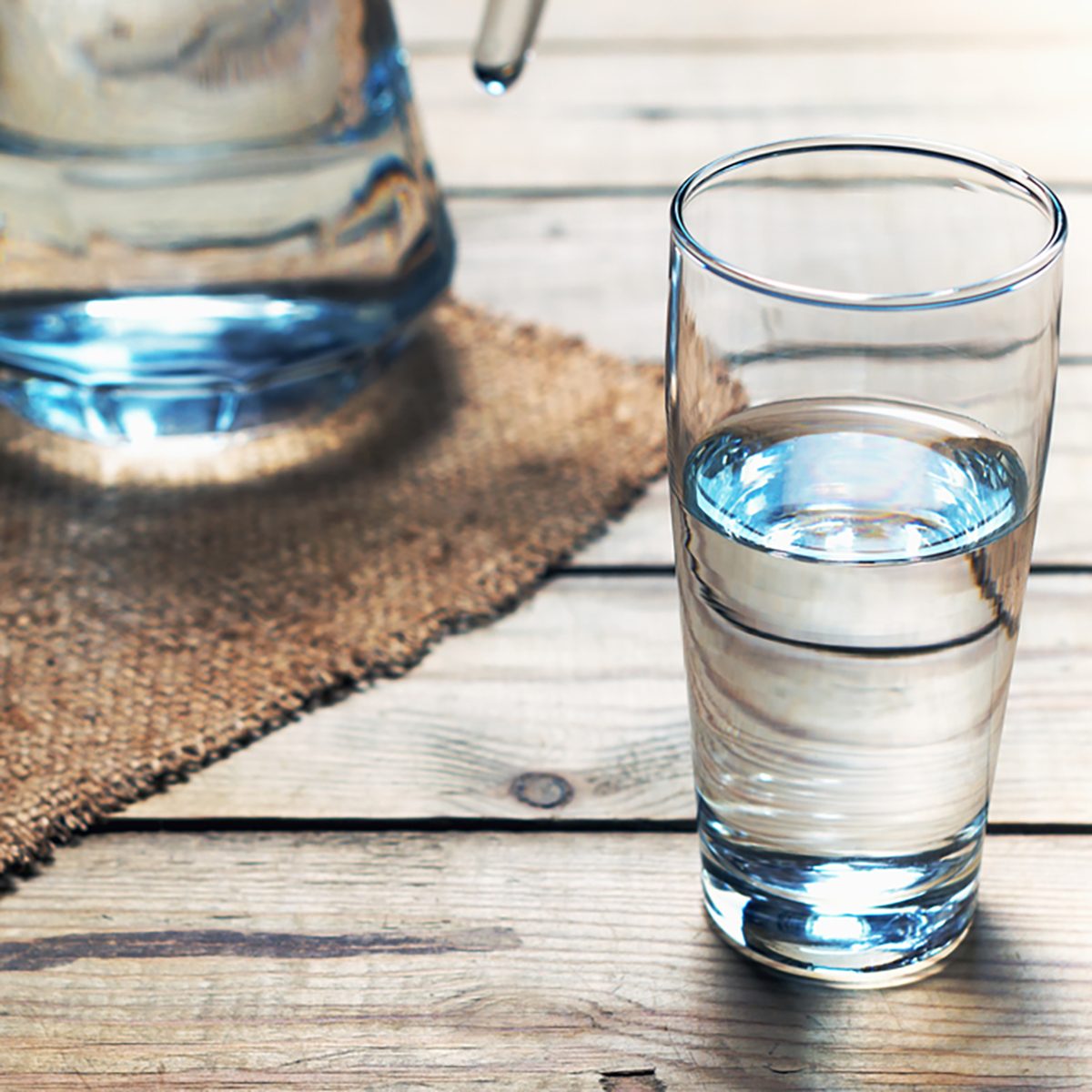 Glasses of water on a wooden table