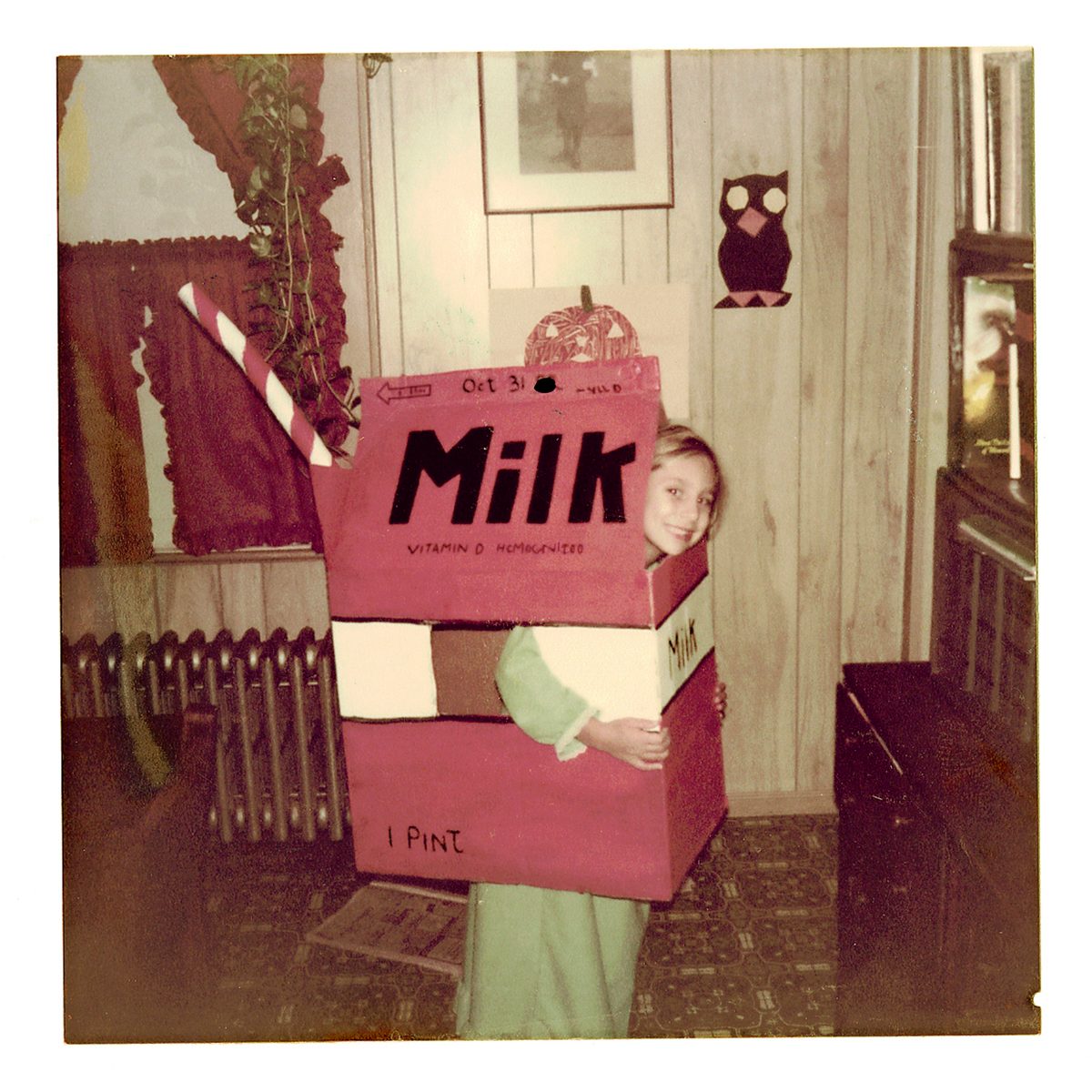 child dressed in Halloween costume