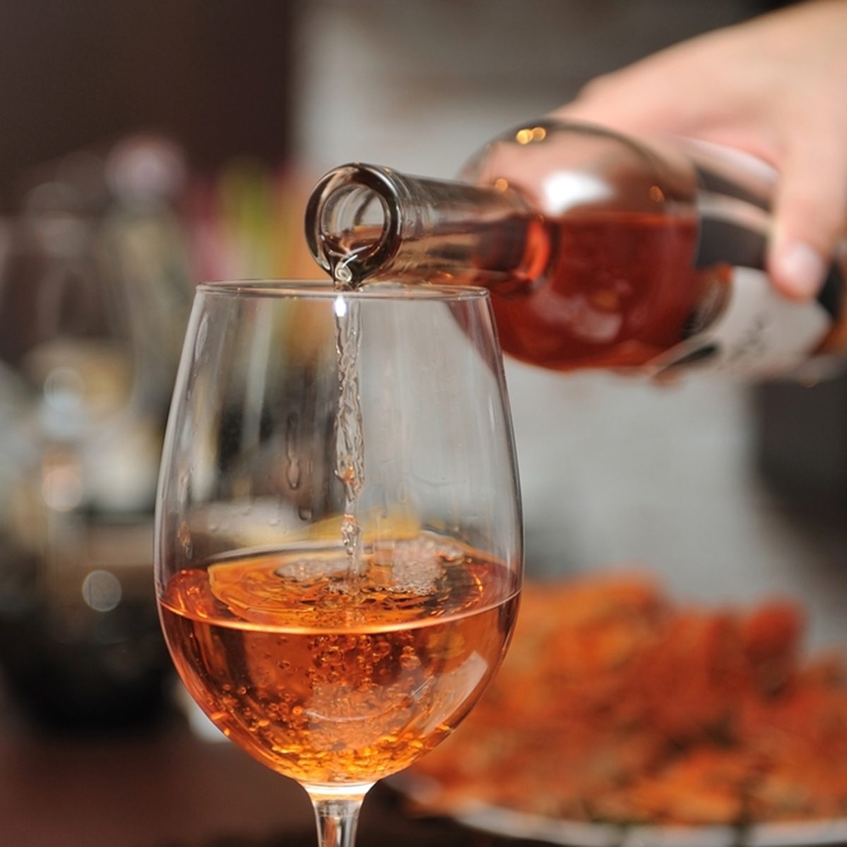 Wine is poured into a glass