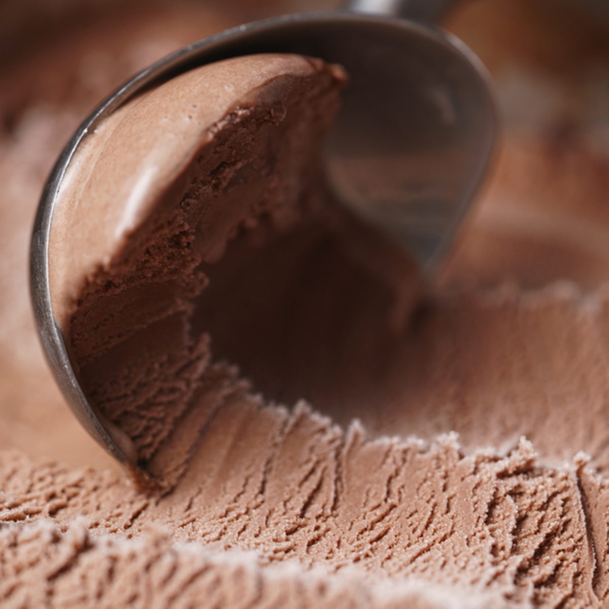 scooping chocolate ice cream close up shot, shallow focus; Shutterstock ID 577491733; Job (TFH, TOH, RD, BNB, CWM, CM): Taste of Home