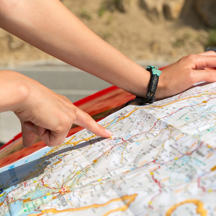 Girl is reading a map