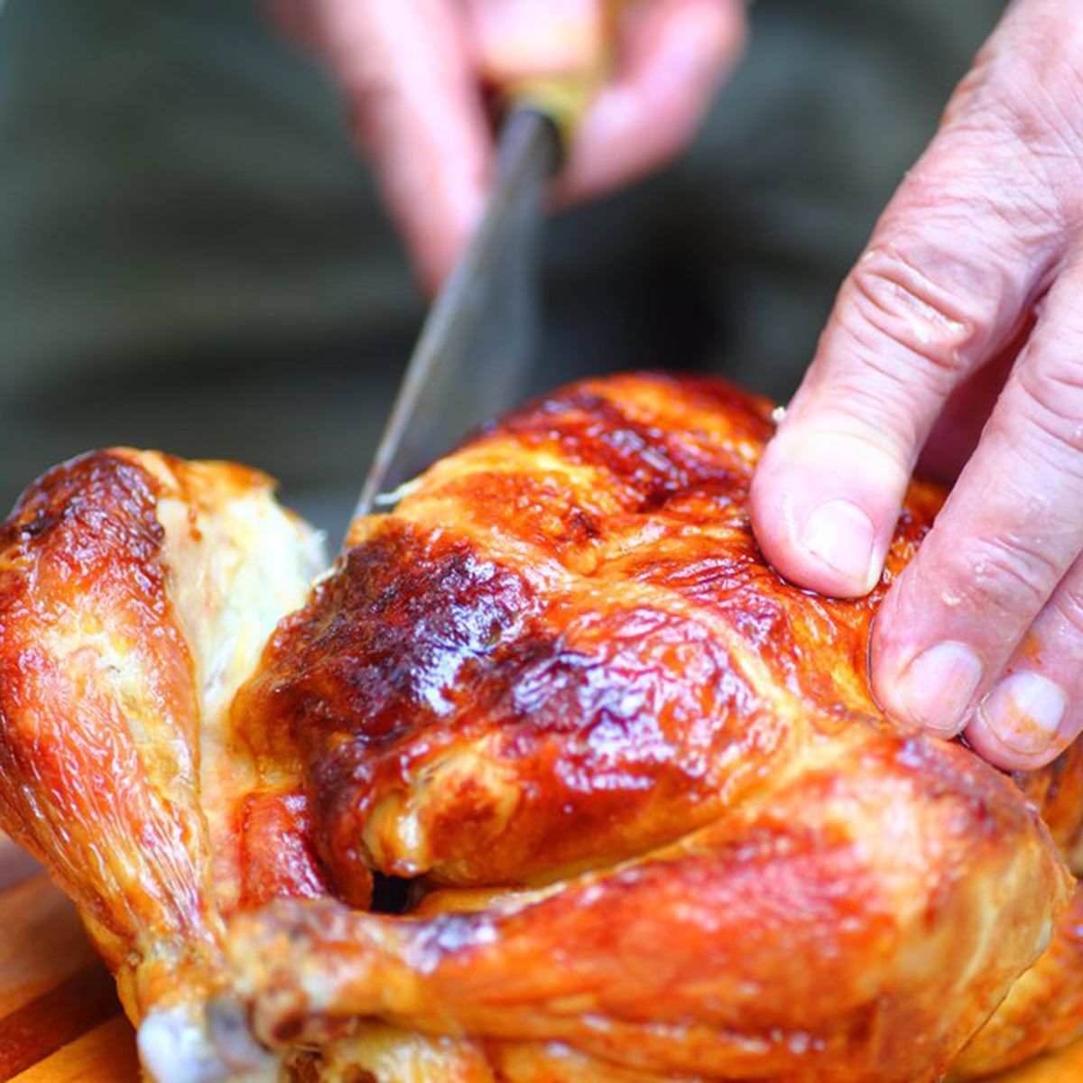 Cutting into a cooked chicken