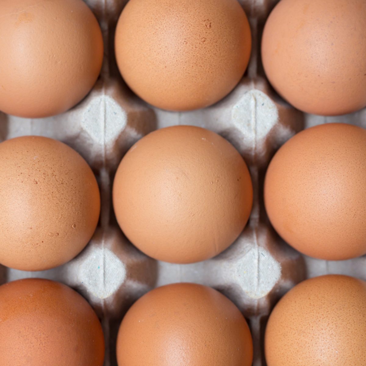 Close up of chicken eggs in package.
