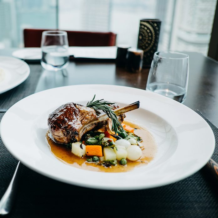 Delicate Main Course Of Braised Lamb Chop And Steak Freshly Served On Table In A Restaurant