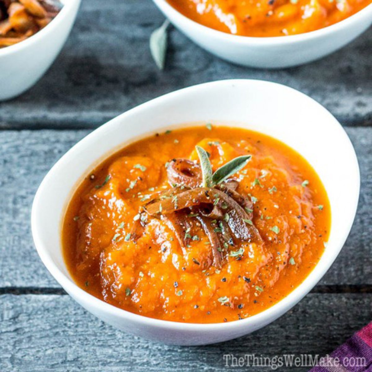 Roasted pumpkin soup with red peppers and caramelized onions