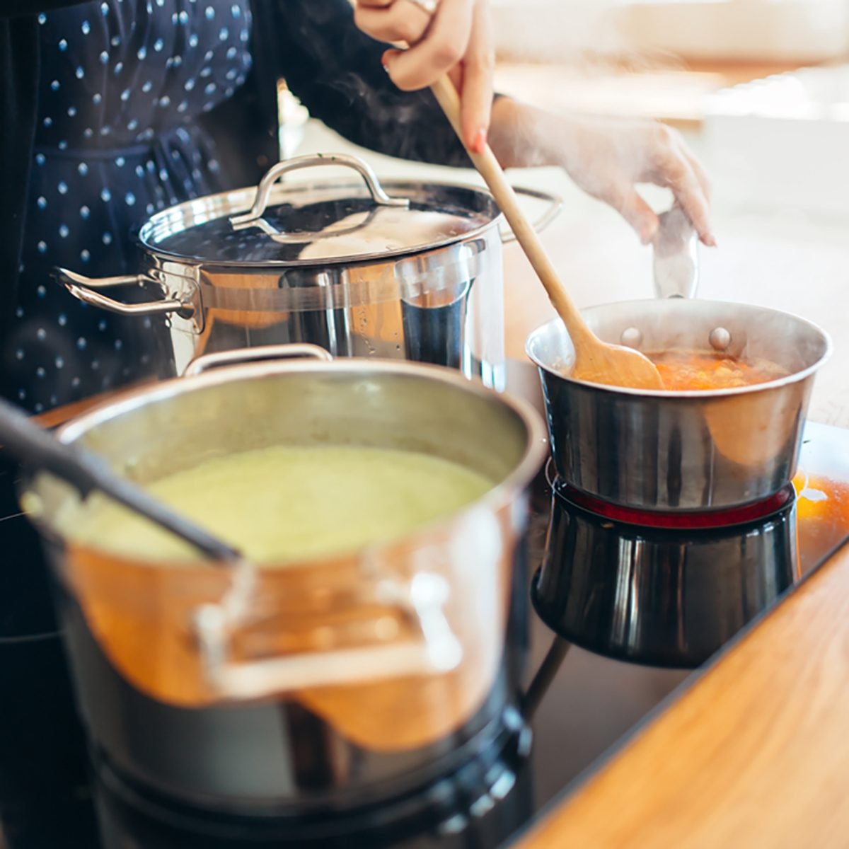 Woman making organic lunch in modern kitchen