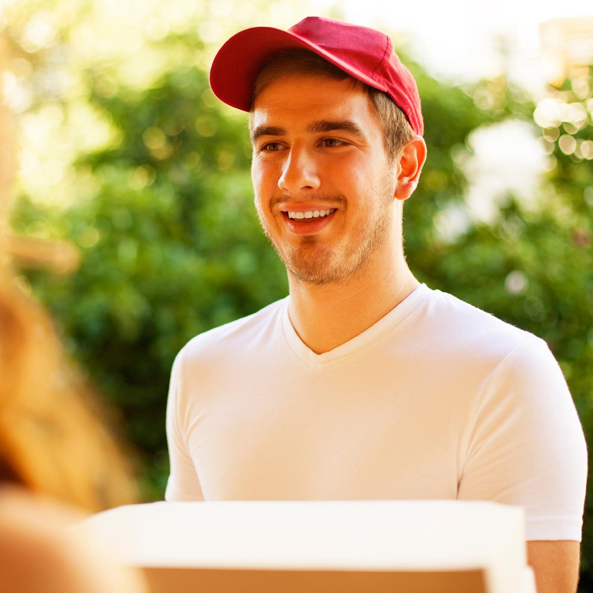 Pizza guy holding pizza