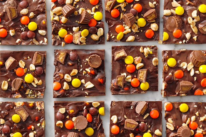 peanut butter cup chocolate peanut bark cut into squares