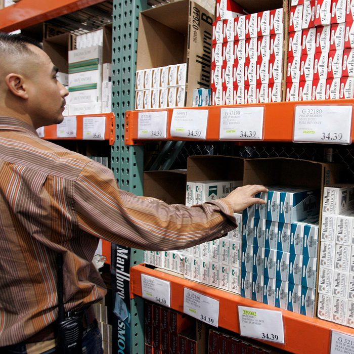 Shopper reaching for items on shelf