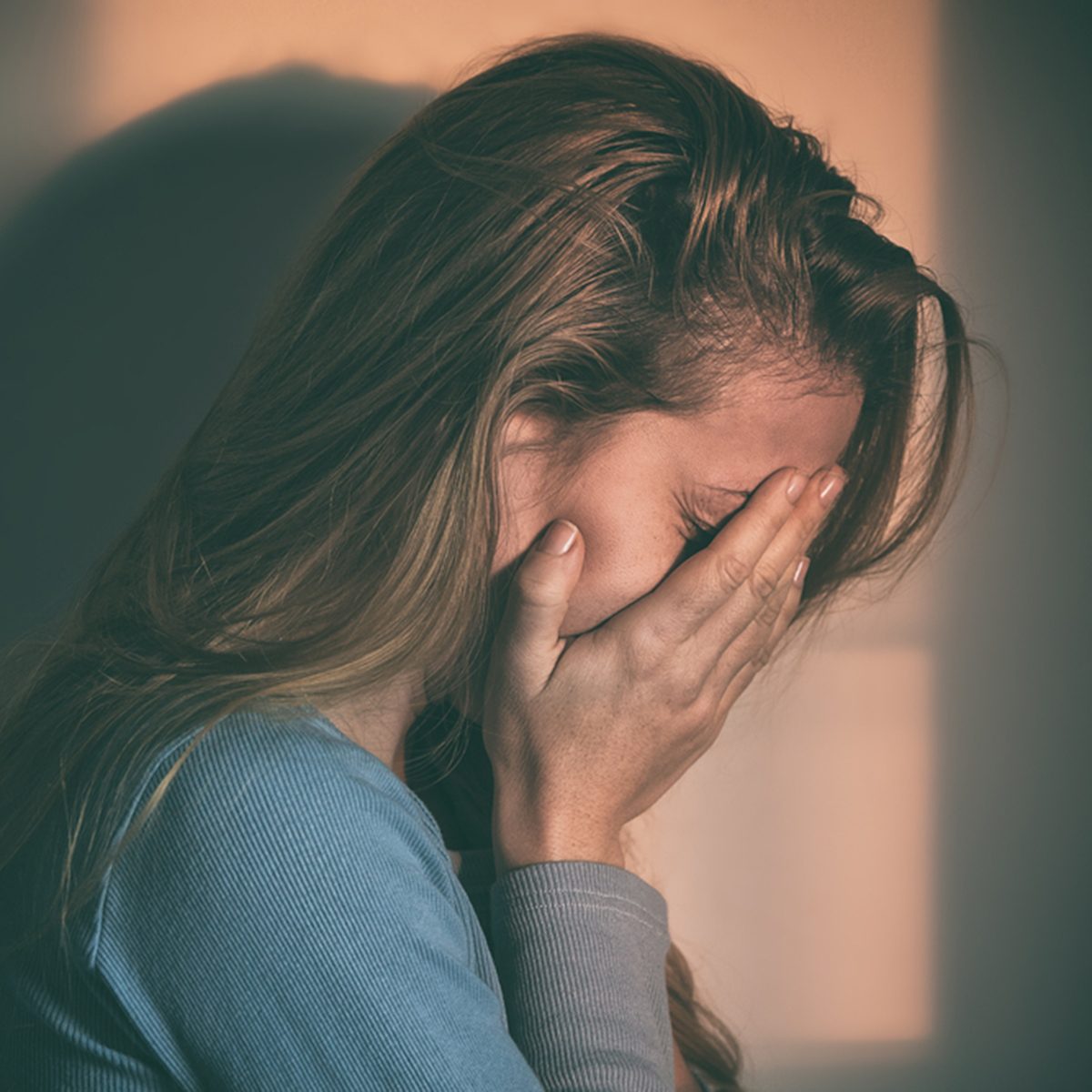 A woman sitting alone and depressed