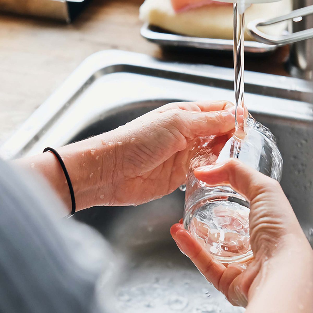 Washing glass in sink