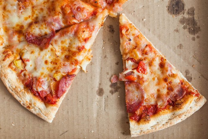 Flat lay of delivered pizza in the box