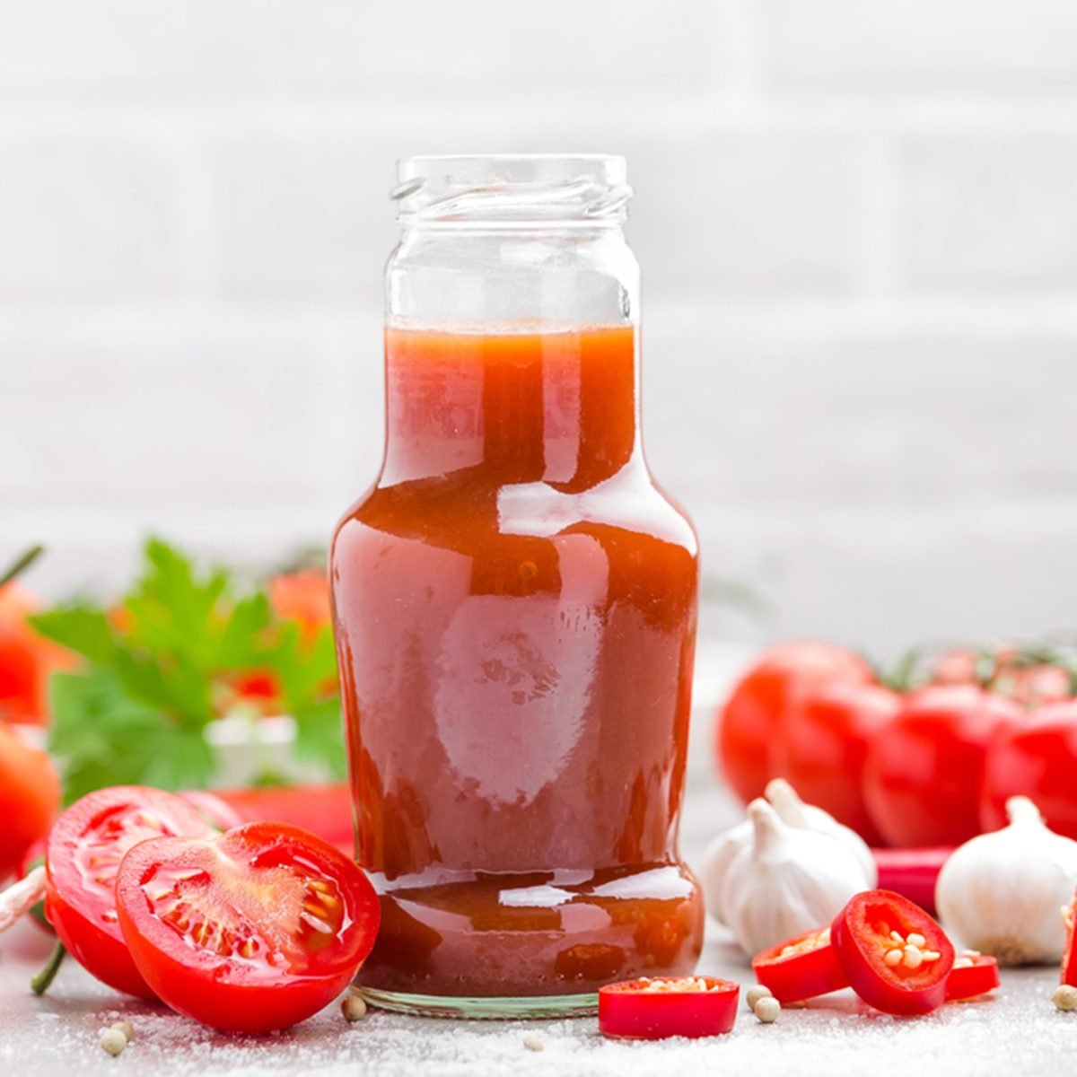 Tomato ketchup, chilli sauce, puree with chili pepper, tomatoes and garlic