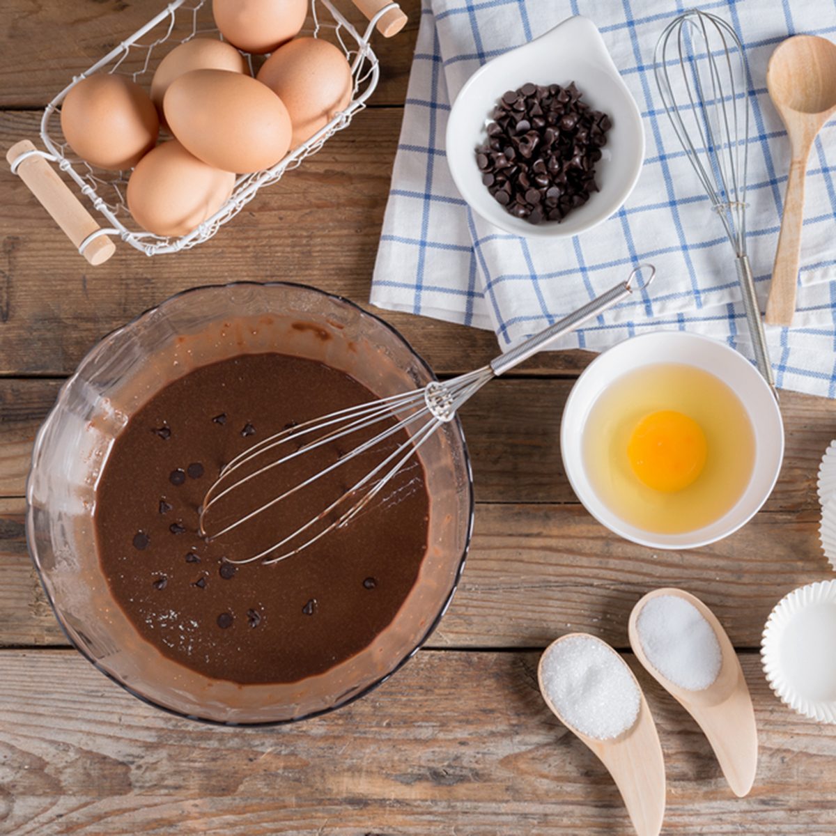 Ingredients for making cup cake chocolate on wooden background.; Shutterstock ID 418249297; Job (TFH, TOH, RD, BNB, CWM, CM): TOH
