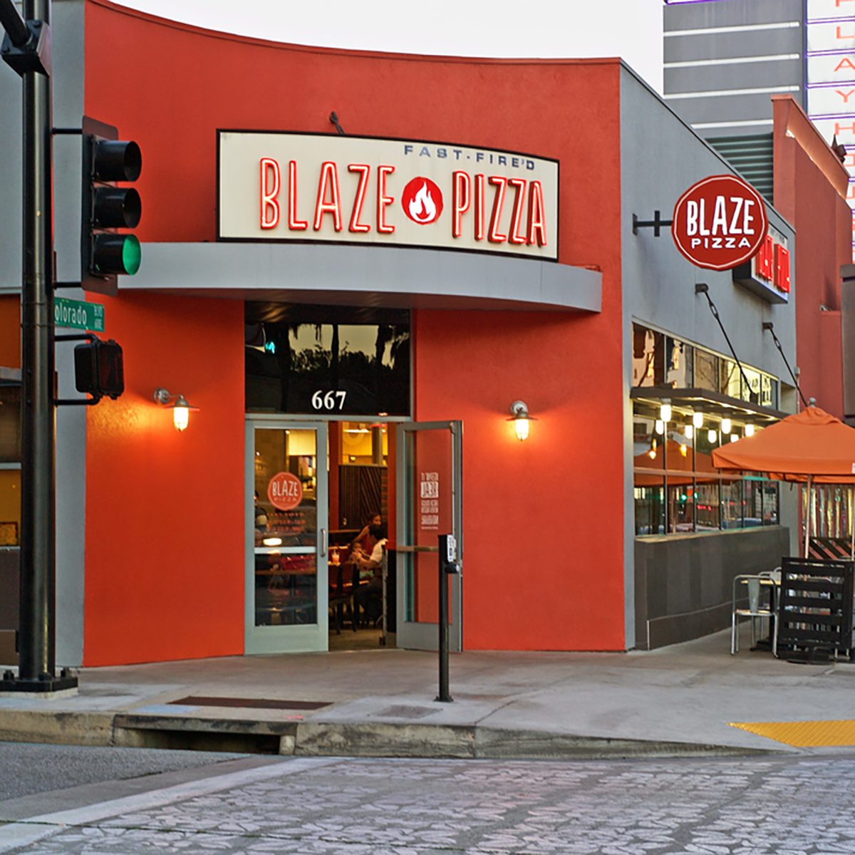 Building facade of the popular Blaze Pizza restaurant. Image was captured after sunset in Pasadena, California USA