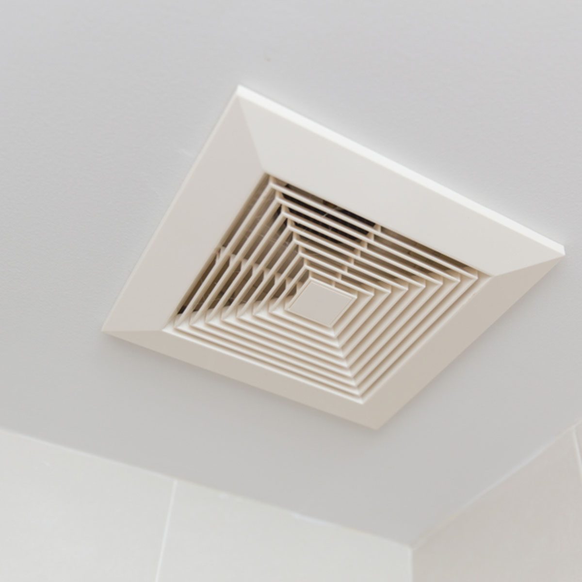 Air ventilation moisture duct in bathroom pipe hole at ceiling.; Shutterstock ID 1169460808; Job (TFH, TOH, RD, BNB, CWM, CM): Taste of Home