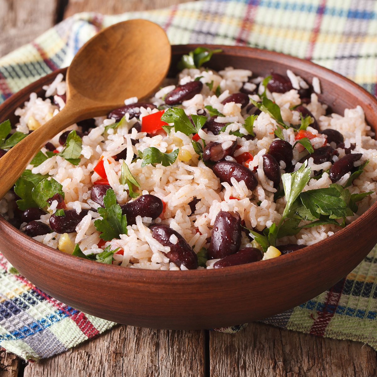 Healthy food: rice with red beans in a bowl close-up on the table.