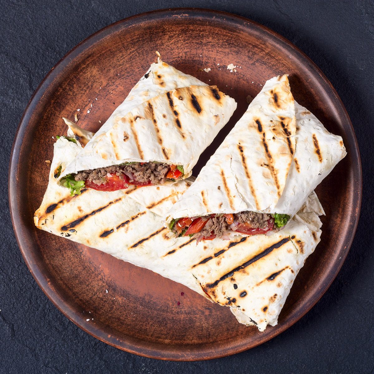 Homemade tasty burrito with vegetables and beef