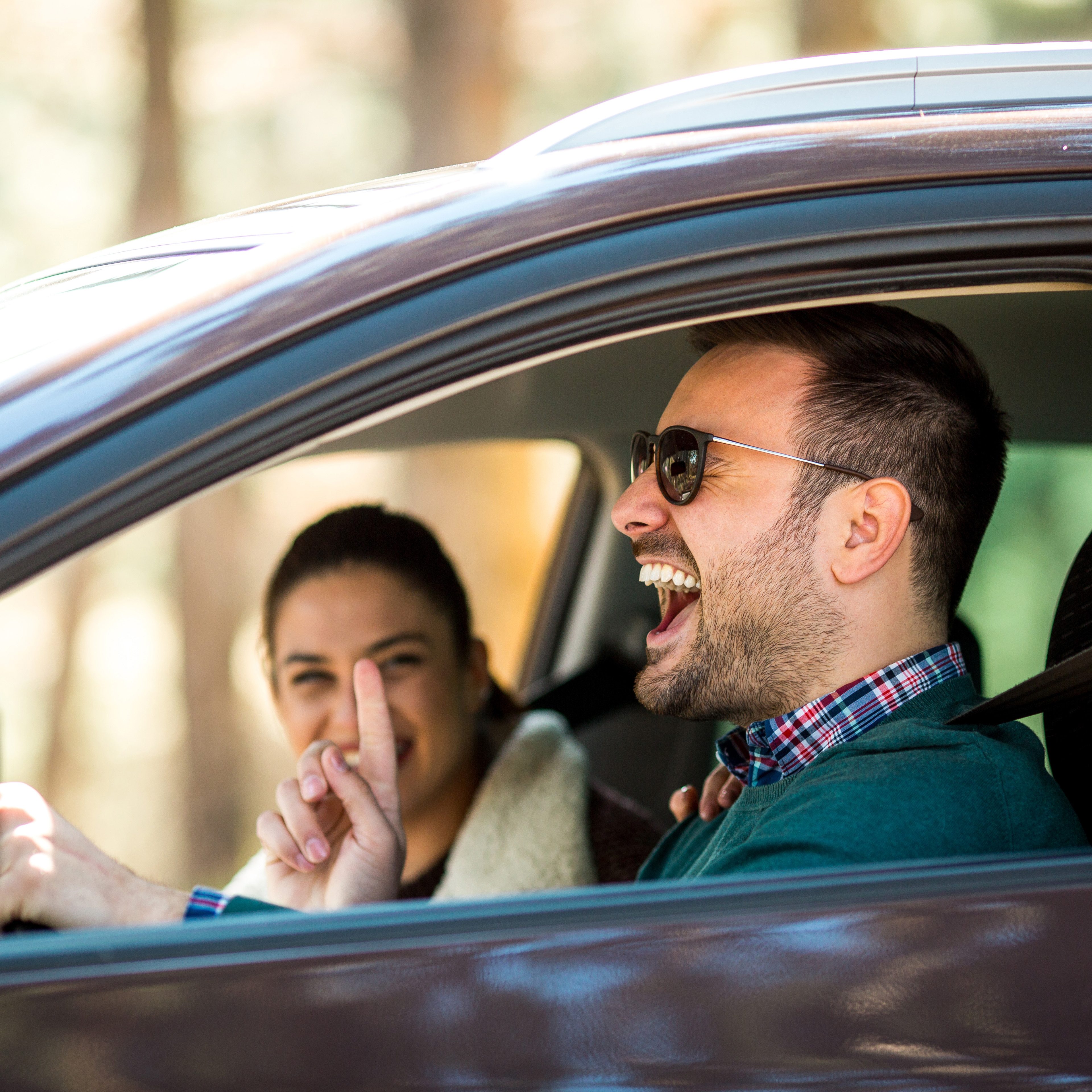 Couple having fun on roadtrip; Shutterstock ID 1412623895; Job (TFH, TOH, RD, BNB, CWM, CM): TOH Road Trip Games