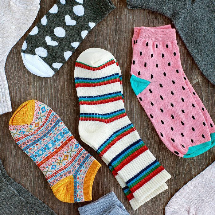 Doctor bandaging patients leg in hospital