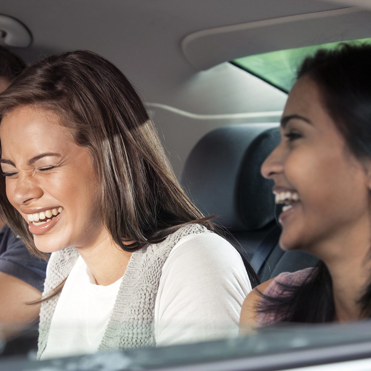 Teenagers riding in car