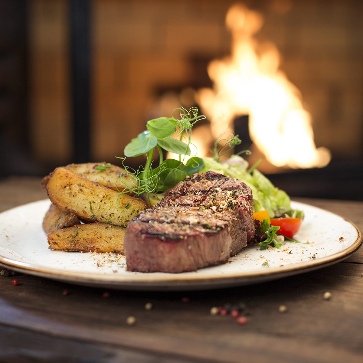 Food - Beef dinner - Delicious grilled stake and potatoes served on a wooden table