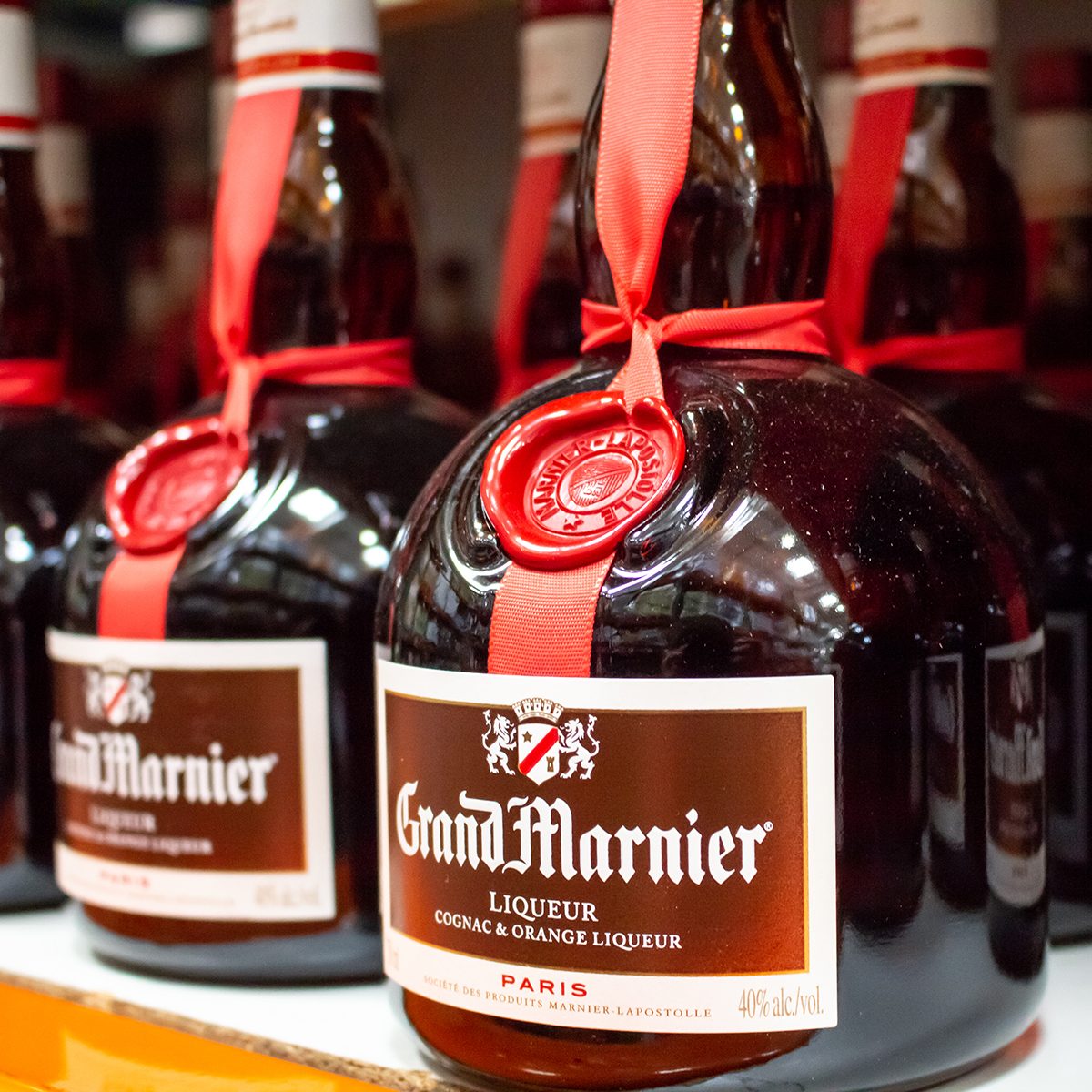 A shelf of Grand Marnier glass bottles, at Costco